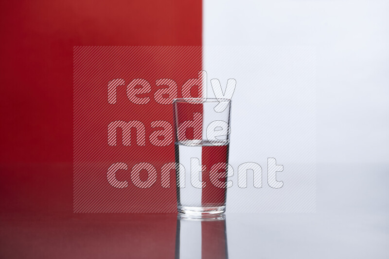 The image features a clear glassware filled with water, set against white and red background