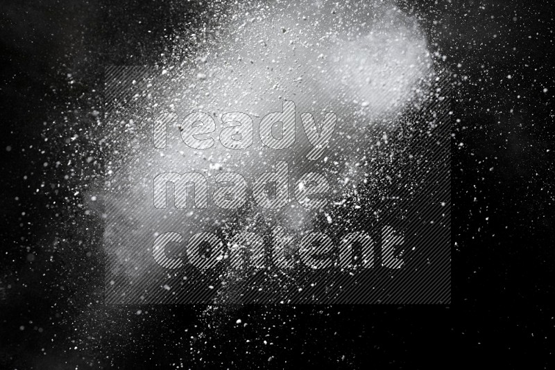 White powder explosion on black background