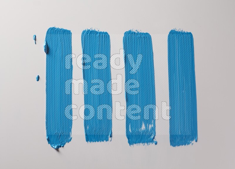 Multi blue straight brush strokes in different shapes on a white background
