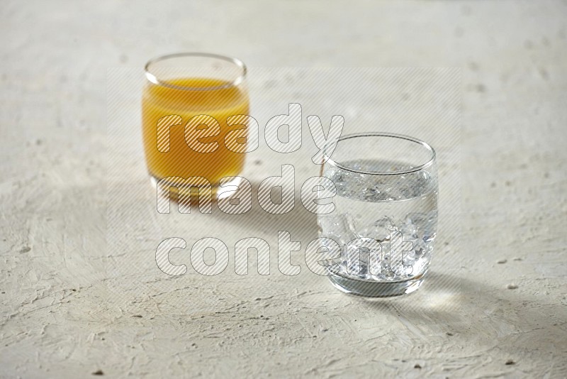 Cold drinks in a glass cup such as water, tamarind, qamar eldin, sobia, milk and hibiscus on textured white background