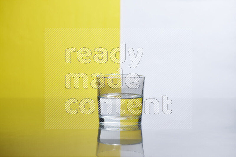 The image features a clear glassware filled with water, set against white and yellow background