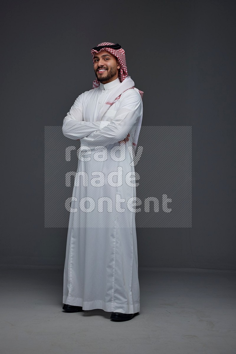 A Saudi man wearing Thobe and Shmagh standing in different poses eye level on a gray background