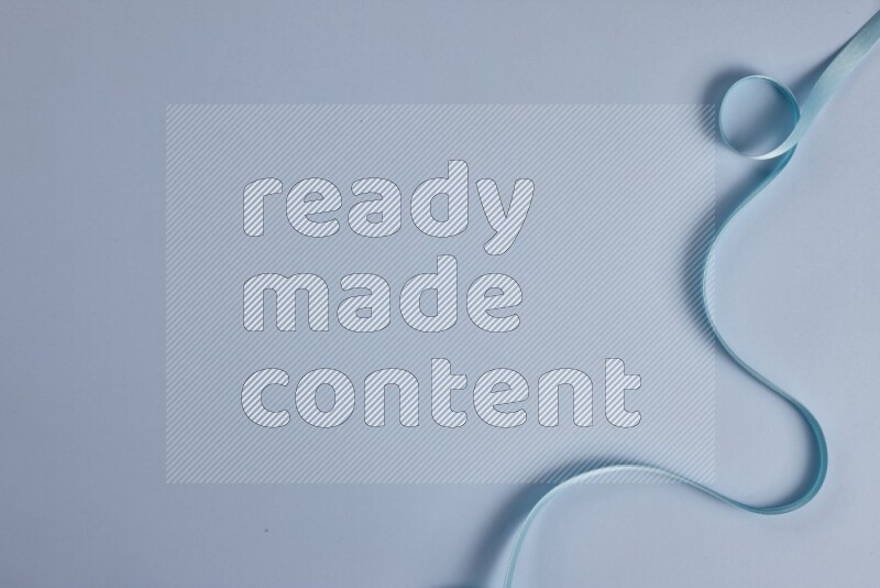 A blue collection of sewing and tailoring tools arranged on a blue background