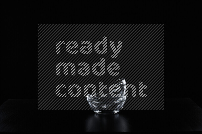 Glassware with rim light against black background