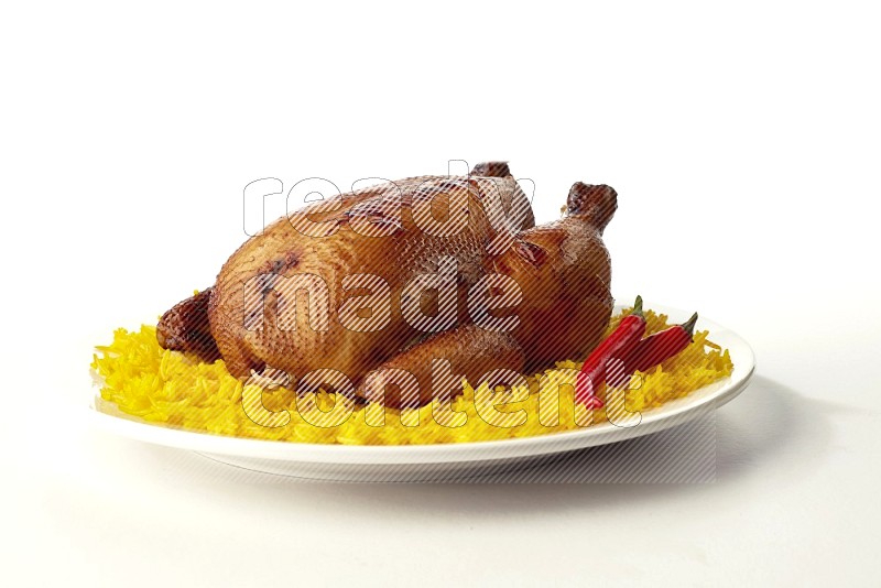 yellow  basmati Rice with  whole roasted chicken on a white rounded plate direct on white background