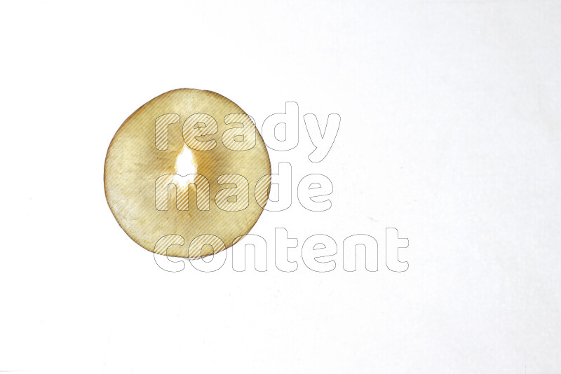 Peach slices on illuminated white background