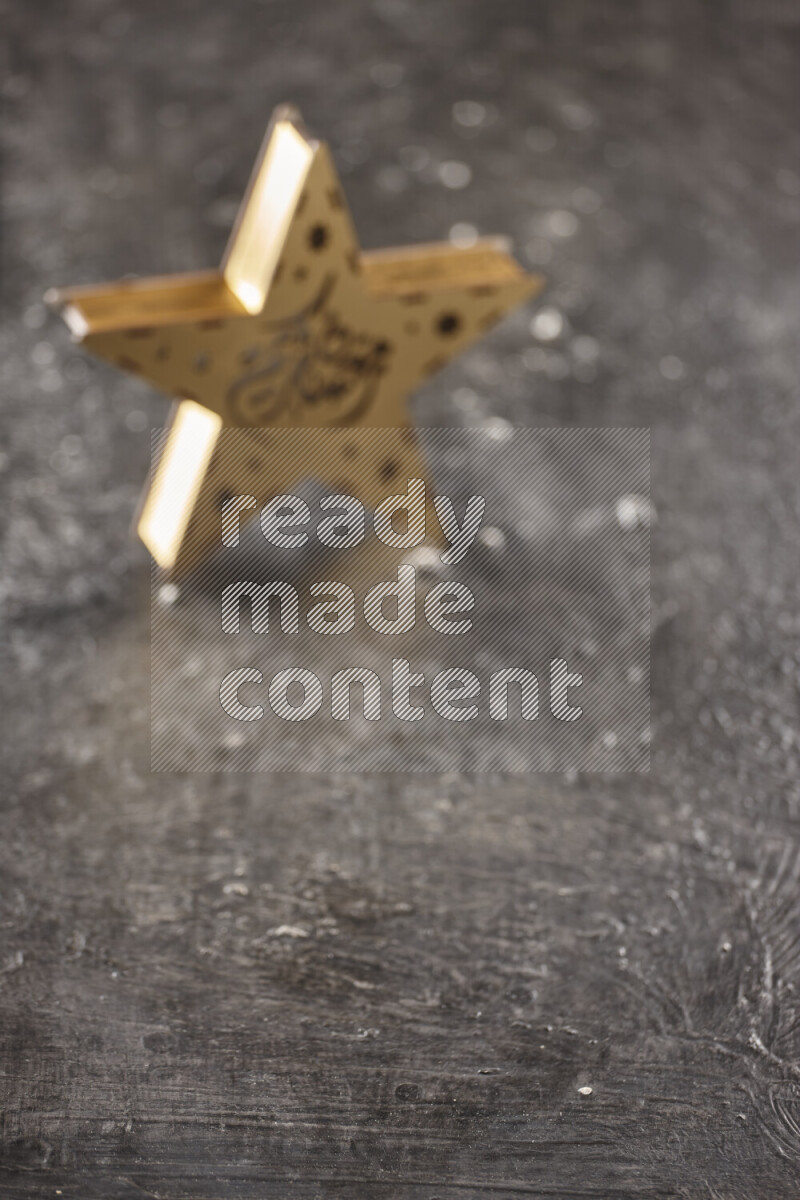 A lantern placed on a textured black background