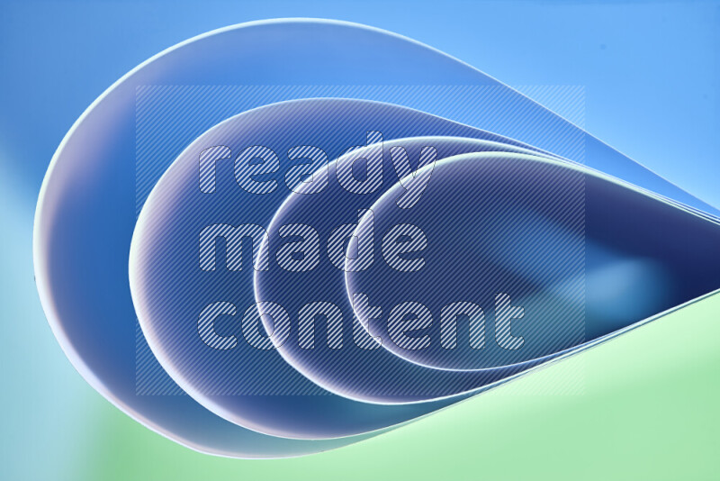 An abstract art of paper folded into smooth curves in green and blue gradients