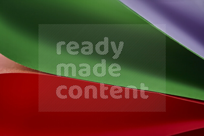 An abstract art showing colorful paper sheets arranged in an overlapping curves