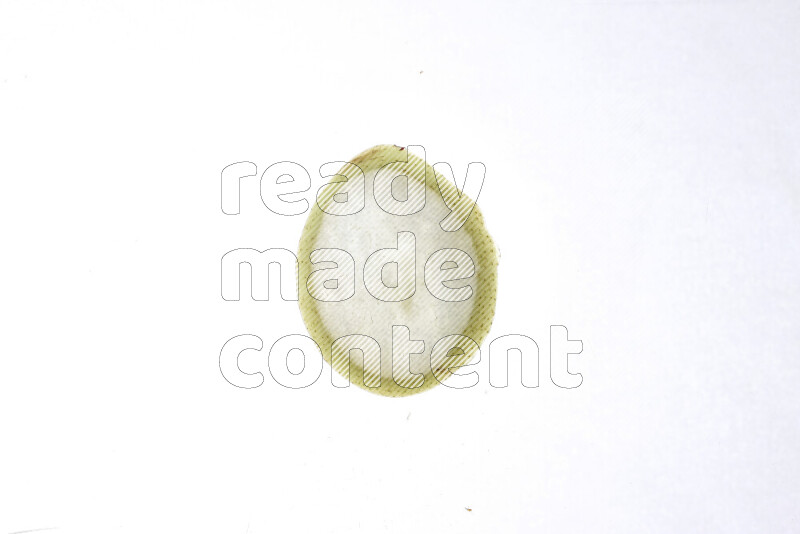 Pear slices on illuminated white background