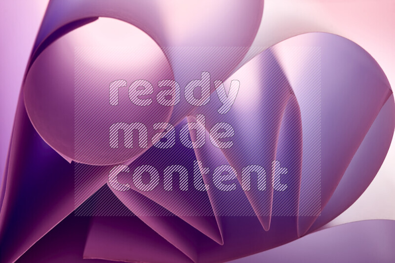 An artistic display of paper folds creating a harmonious blend of geometric shapes, highlighted by soft lighting in purple tones