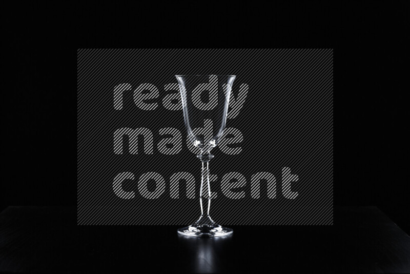 Glassware with rim light against black background