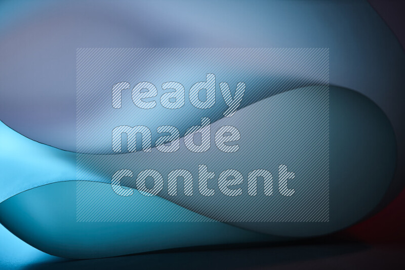 فن تجريدي يعرض منحنيات وتدرجات اللون الأزرق مكونه بضوء ملون