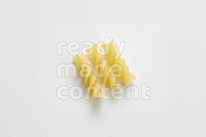 Fusilli pasta on white background