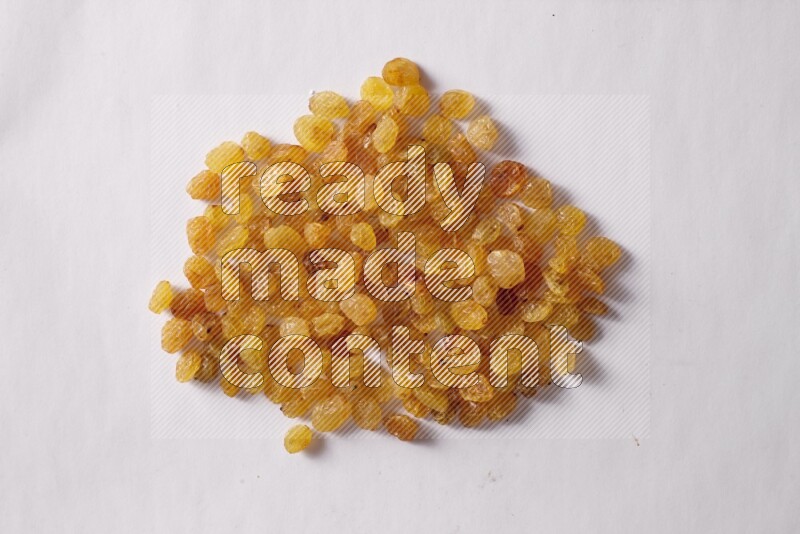 Raisins on white background