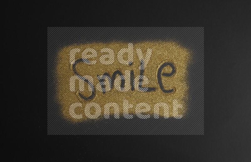 A word written with gold glitter on black background