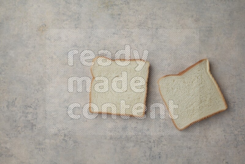 White Toast slices on alight blue textured background