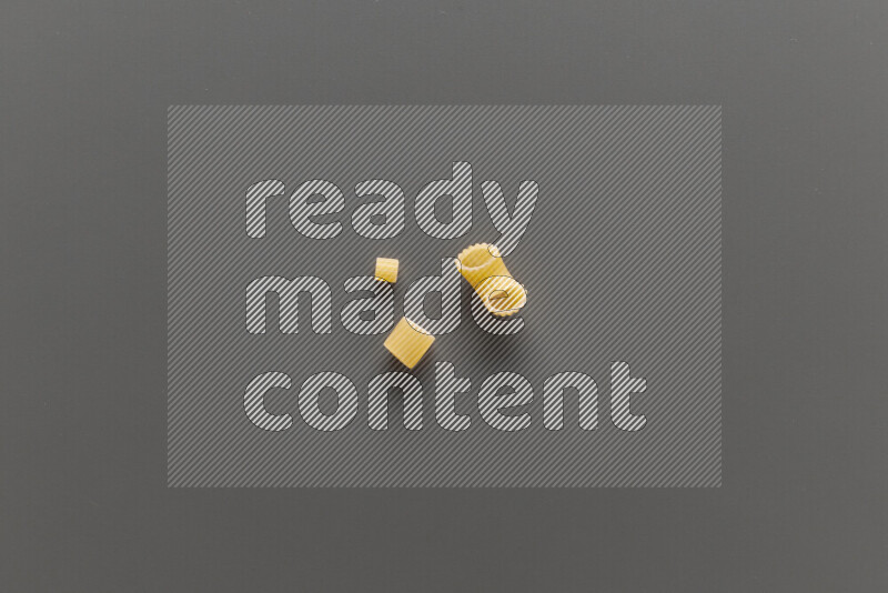 Different pasta types on grey background