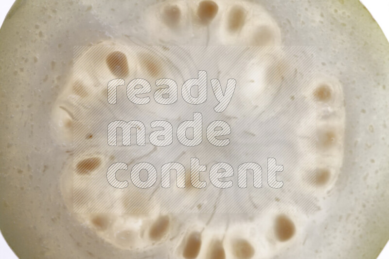 Guava slices on illuminated white background