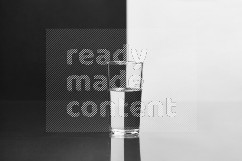 The image features a clear glassware filled with water, set against white and black background