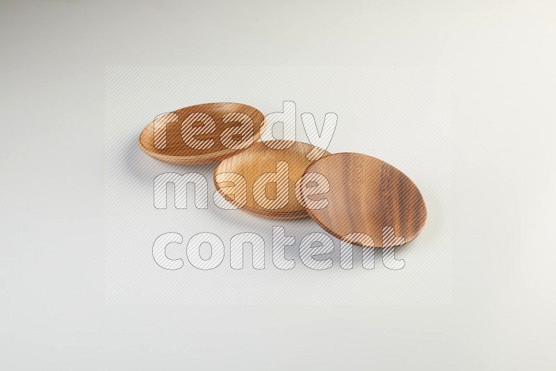 Wooden bowl and plate on white background