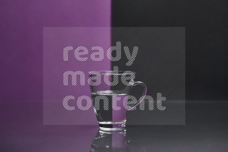 The image features a clear glassware filled with water, set against purple and black background