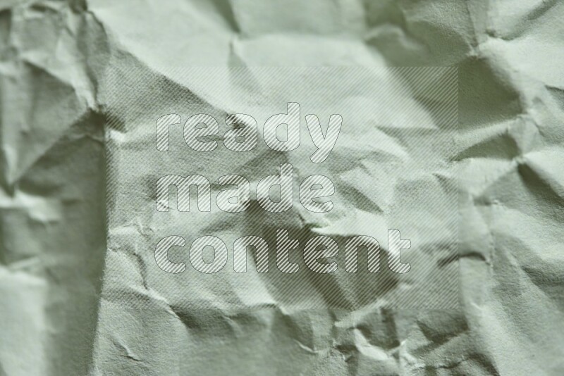 Crumpled craft paper on black background
