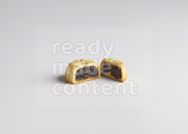 Half Maamoul filled with date direct on white background