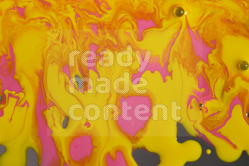 Abstract colorful background with mixed of pink and yellow paint colors