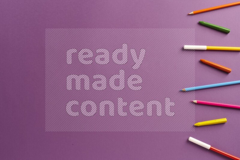 Different school supplies on purple background