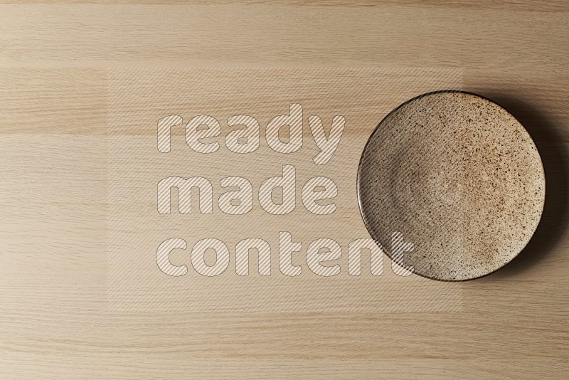 Top View Shot Of A Multicolored Pottery Plate on Oak Wooden Flooring