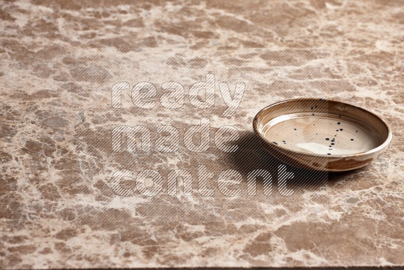 Multicolored Pottery Bowl on Beige Marble Flooring