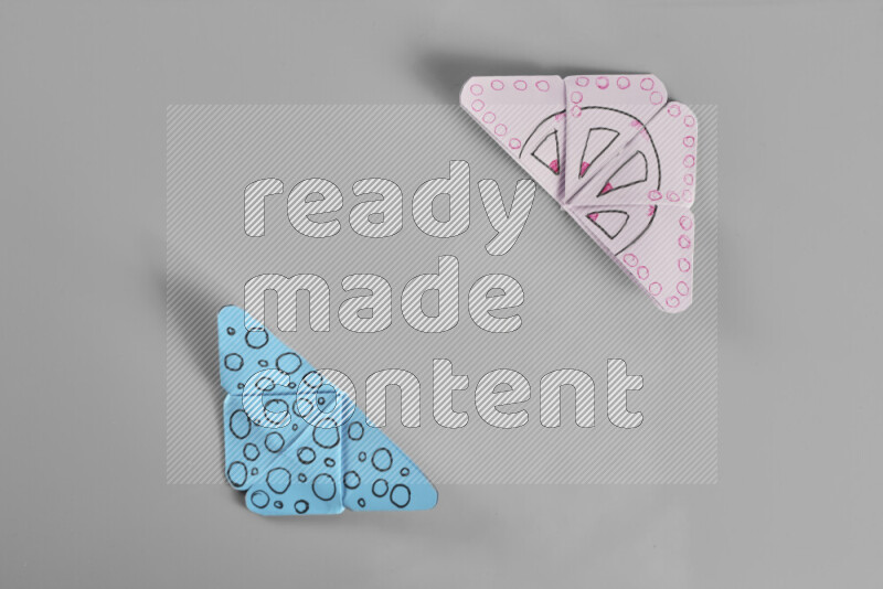 Origami butterfly on grey background
