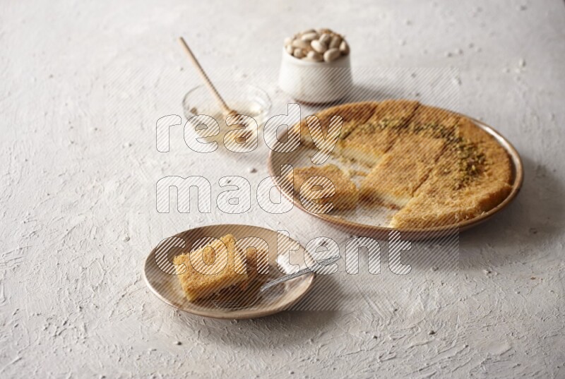 Konafa with nuts and honey in a light setup