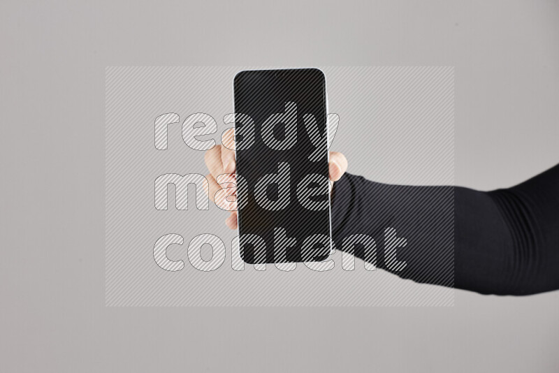 Woman hands holding different mobile phones in different positions