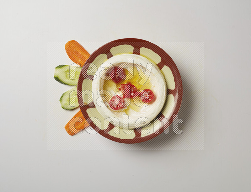 Lebnah garnished with Cherry tomato in a traditional plate on a white background