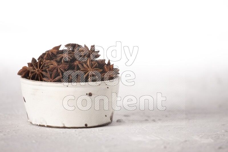 Star Anise in a white bowl on white background