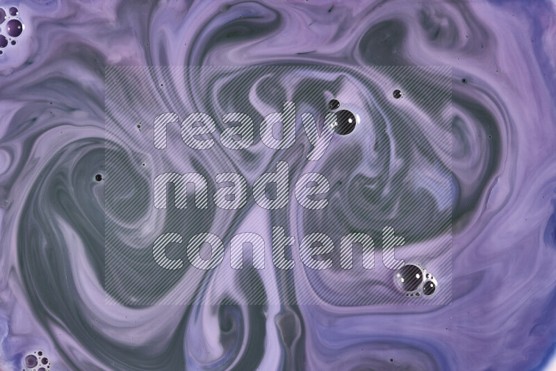 A close-up of abstract swirling patterns in blue, pink and green