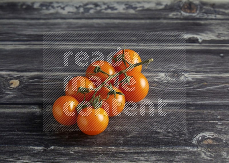 45 cherry tomato vein on a textured grey wooden background