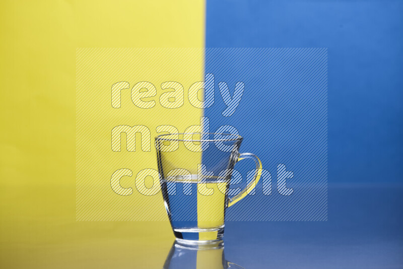 The image features a clear glassware filled with water, set against yellow and blue background