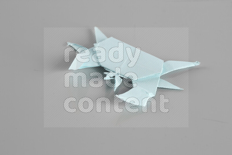 Origami animals on grey background