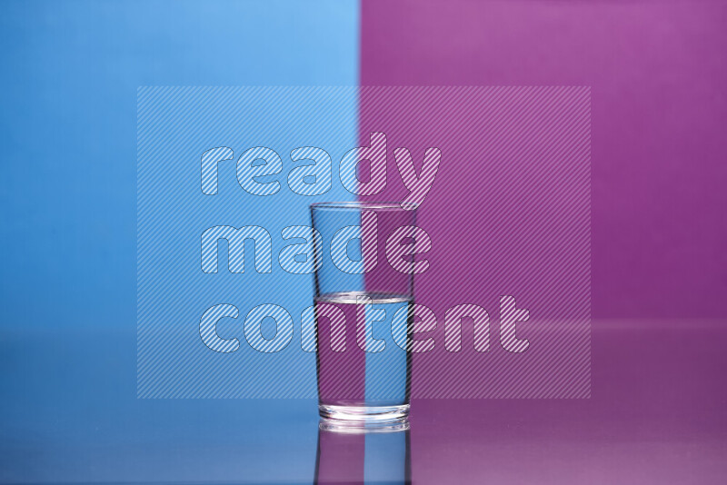 The image features a clear glassware filled with water, set against blue and purple background