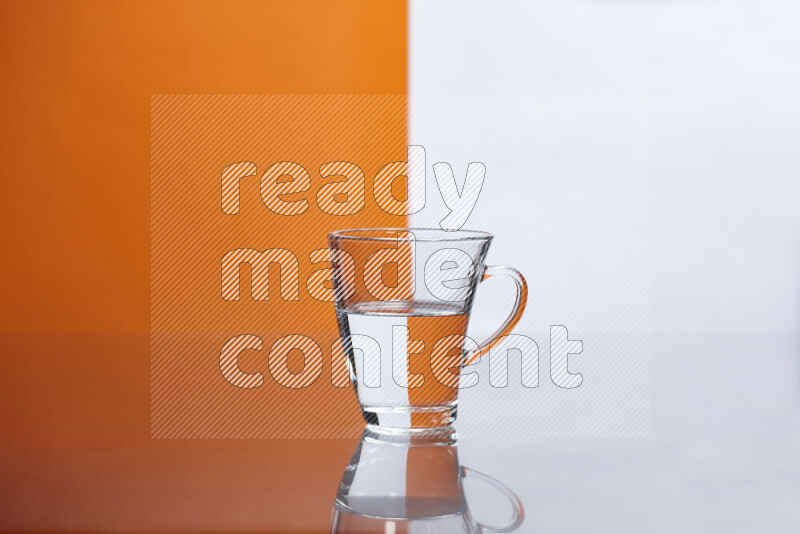 The image features a clear glassware filled with water, set against white and orange background