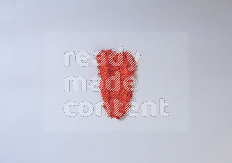 Red powder strokes on white background