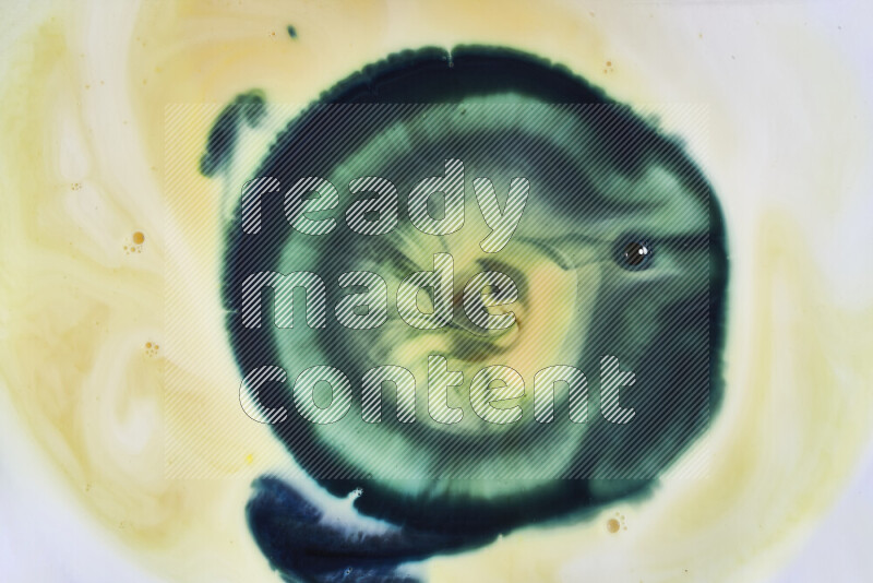 A close-up of abstract swirling patterns in yellow and green