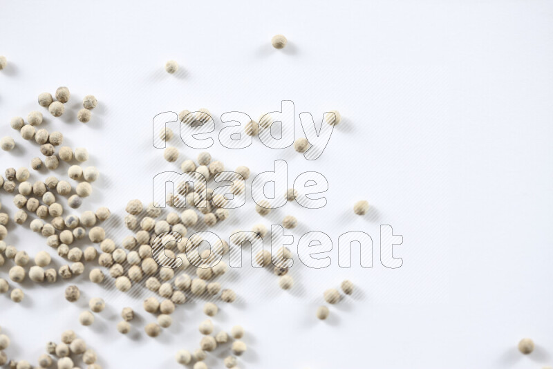 White pepper beads on white background