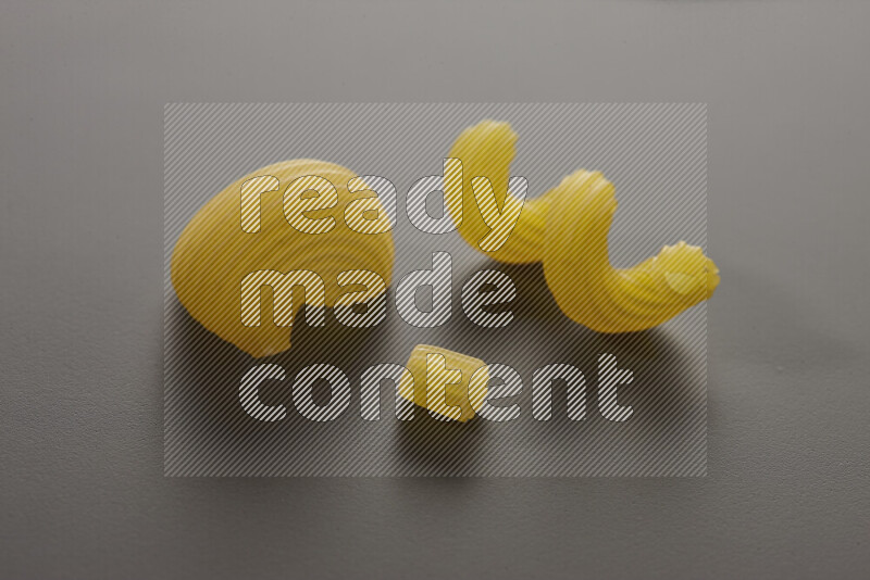 Different pasta types on grey background