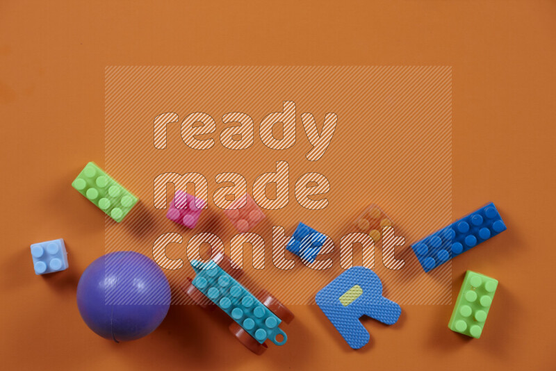 Plastic building blocks with balls on different colored background (kids toys)