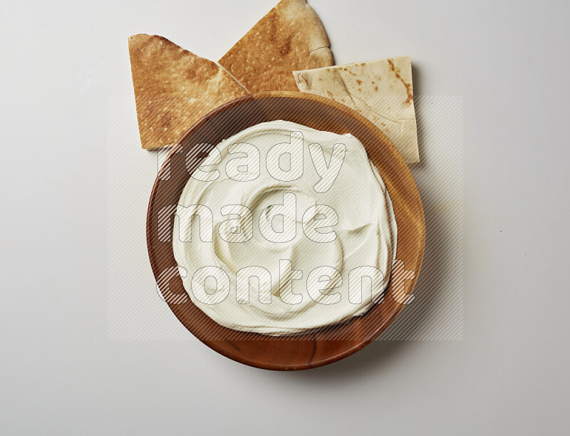 Plain Lebnah in a wooden plate on a white background