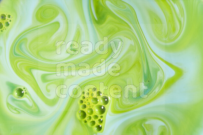 A close-up of abstract swirling patterns in green gradients